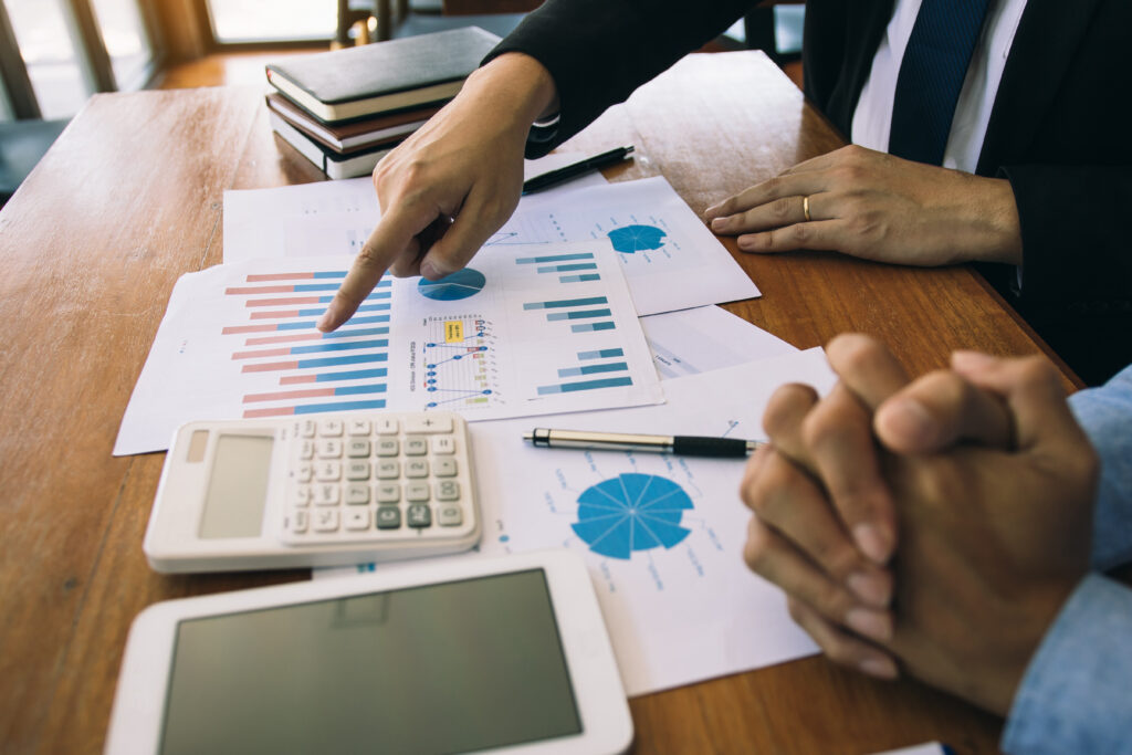 image of people reviewing financial and bookkeeping documents