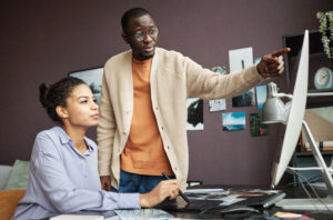 business owner talking with co-worker