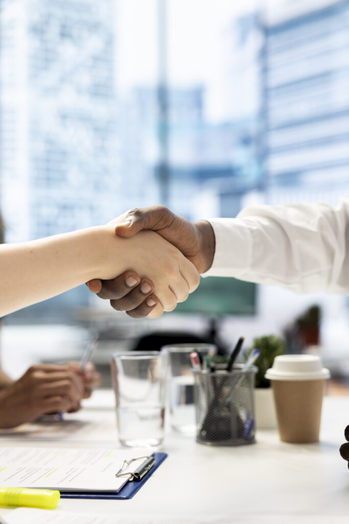 people shaking hands in agreement